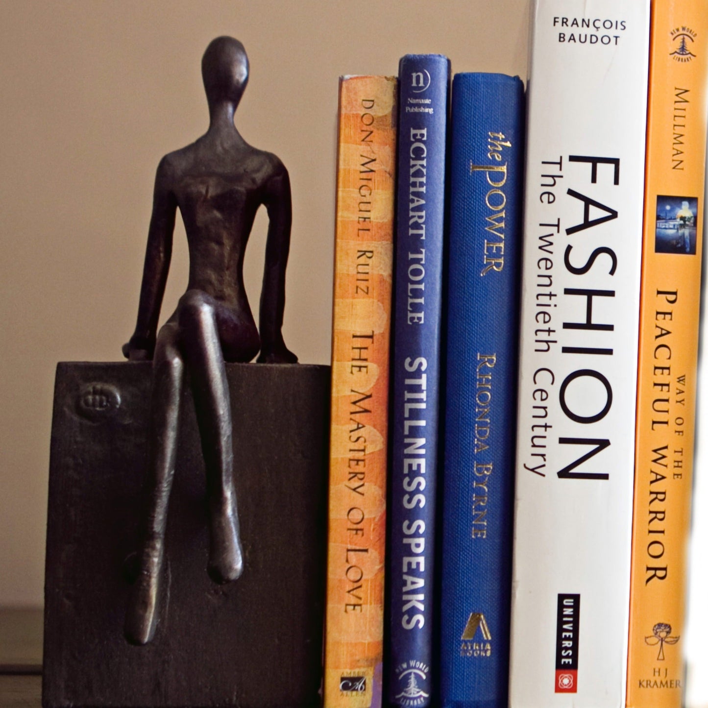 Bookend Set with Man and Woman Sitting on a Block